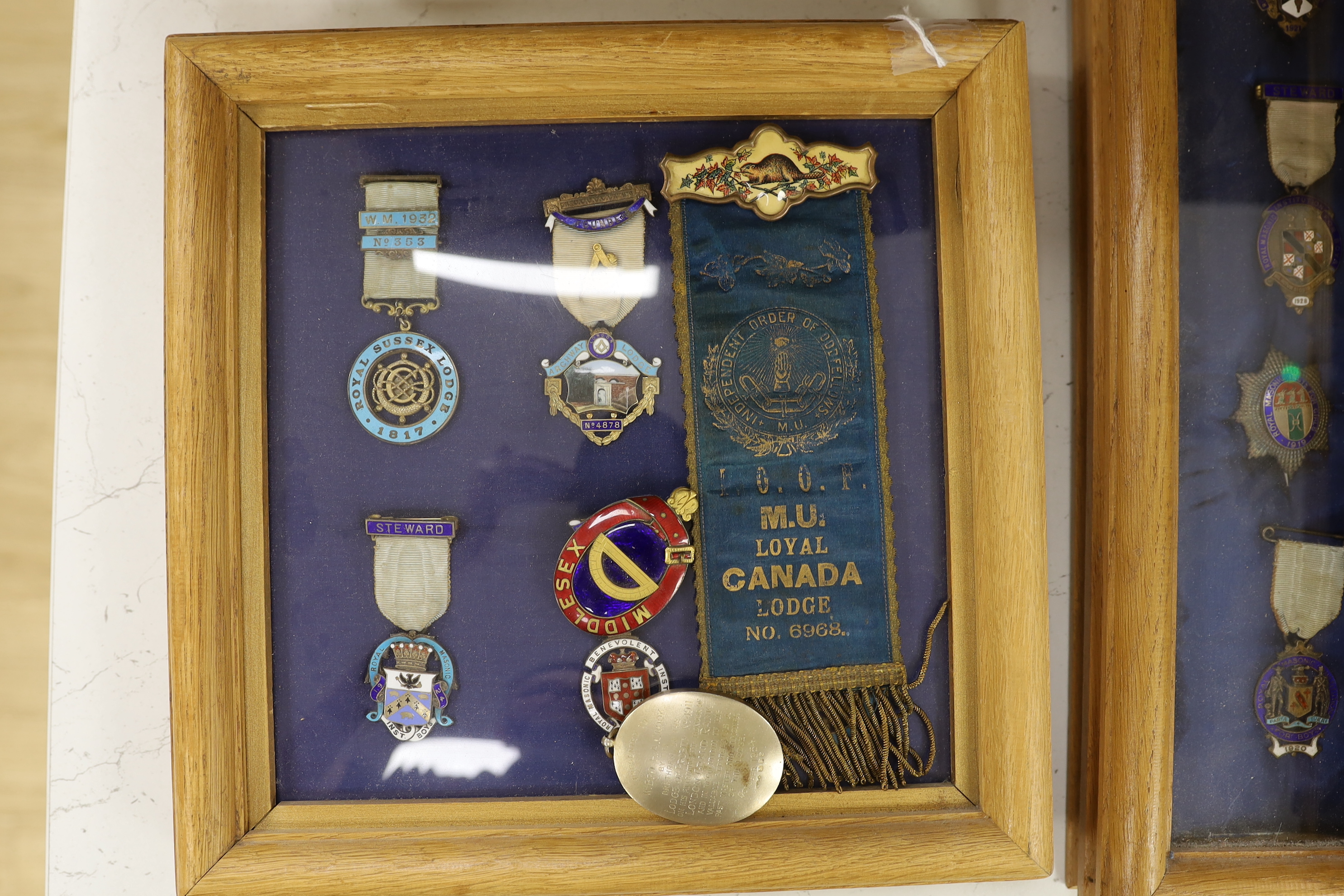 A collection of 20th century enamelled silver gilt or gilt metal Masonic medals with ribbons and clasps, approx. 47 in silver, and similar badges (mounted in 10 cases)